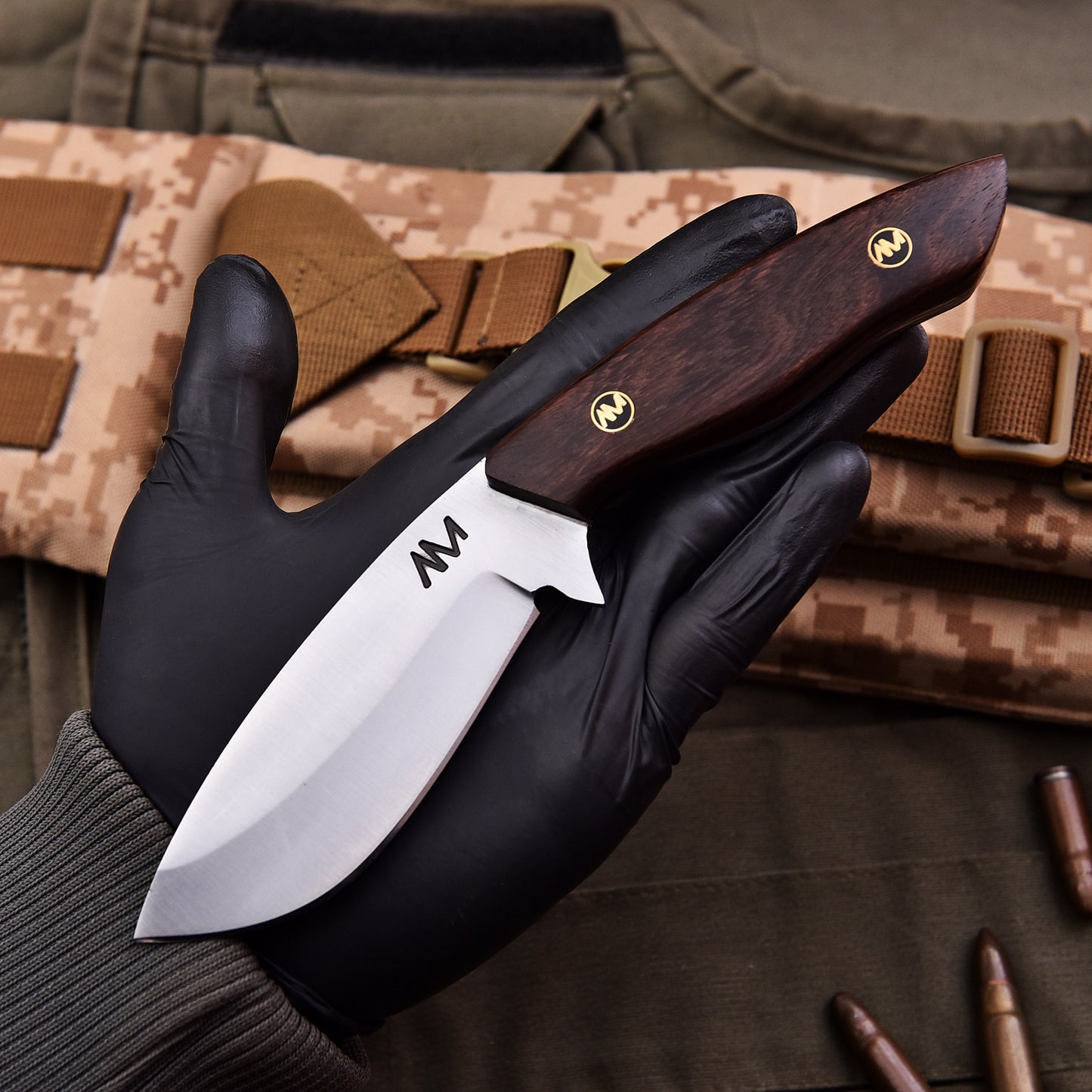 Man holding AM Titan knife during outdoor bushcraft activity