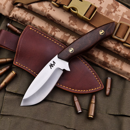 AM Titan hunting knife paired with custom leather sheath – outdoors ready