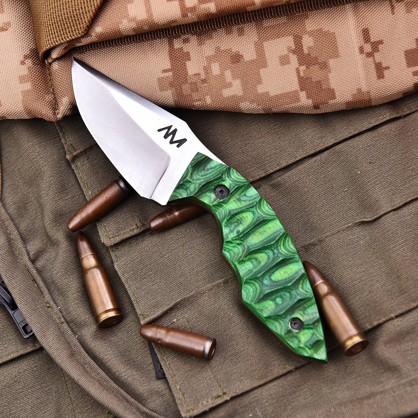 Top view of AM Viper tactical knife highlighting blade edge and laminated grip