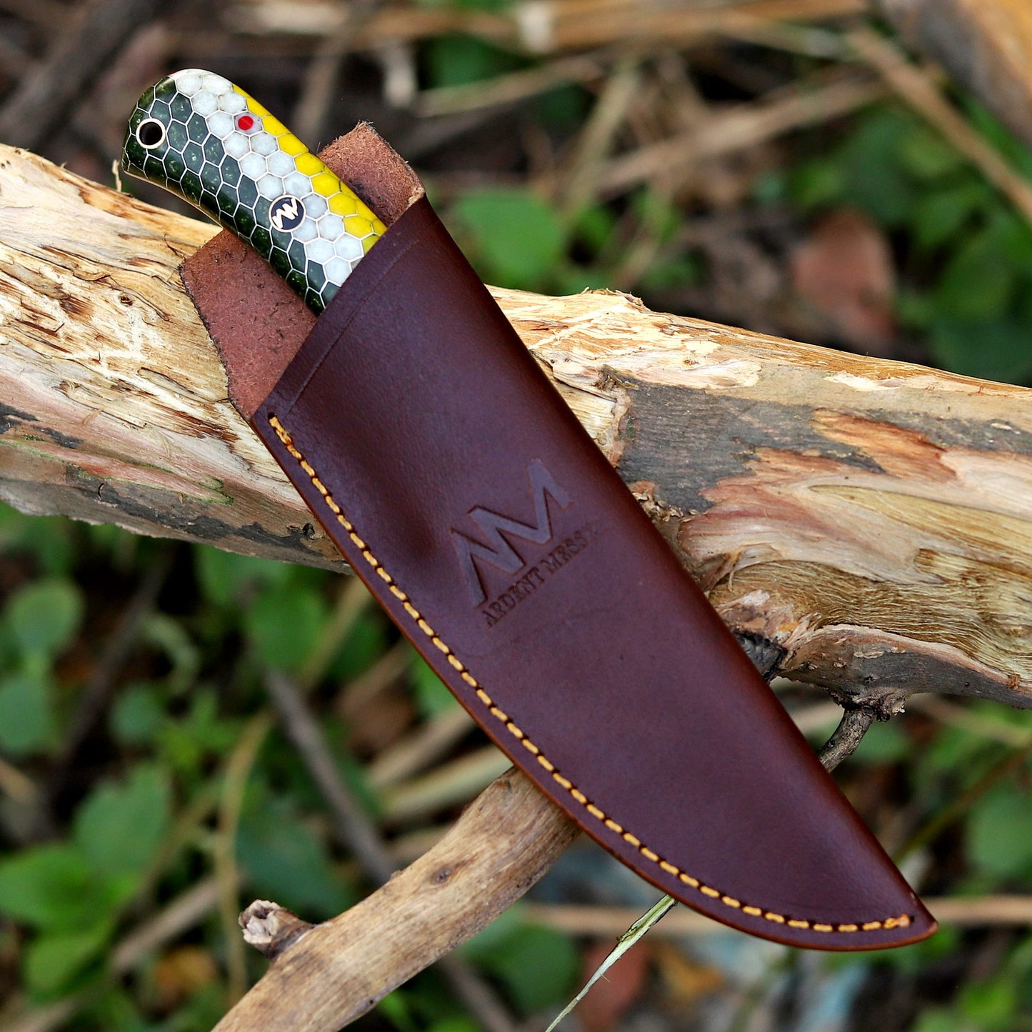 AM Hexfire Damascus knife paired with vertical carry leather sheath for hunting and outdoor use.