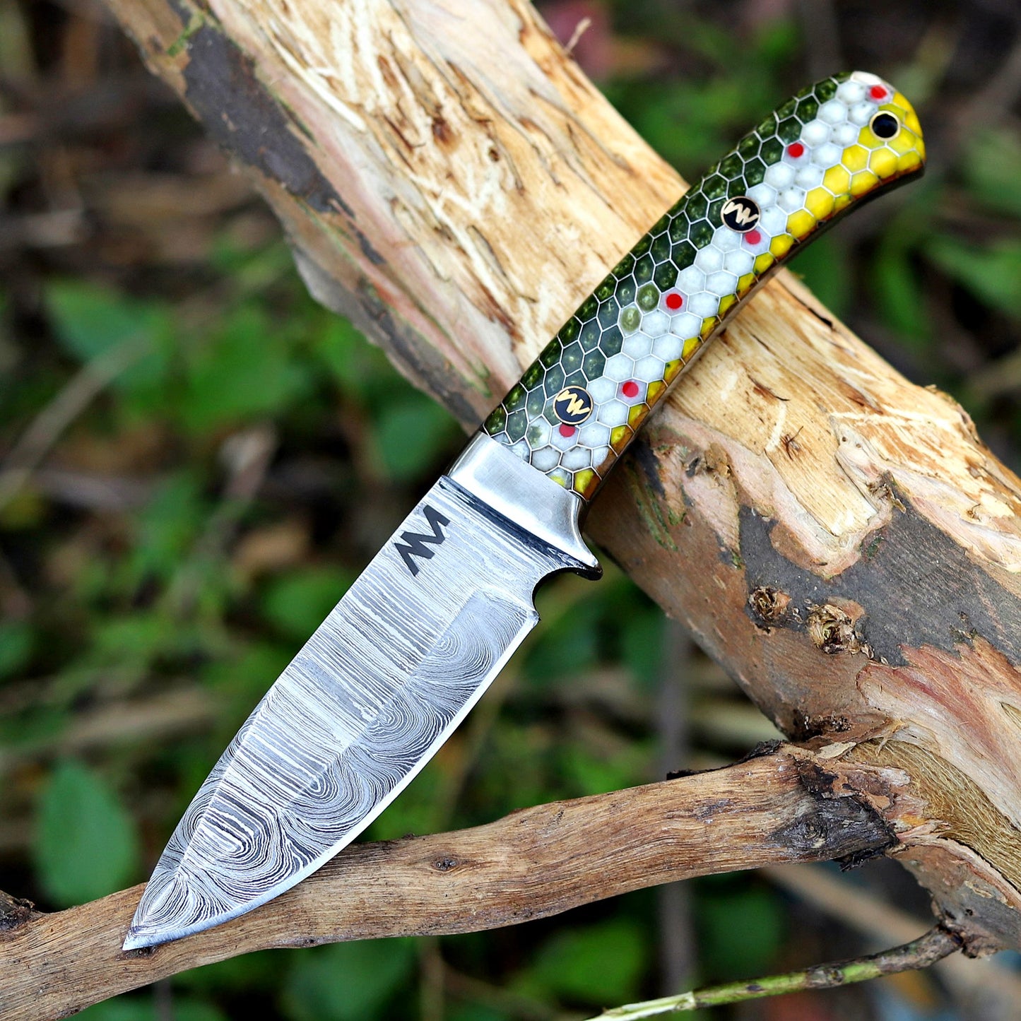 Custom Damascus knife resting on wood background, highlighting forge texture and craftsmanship.