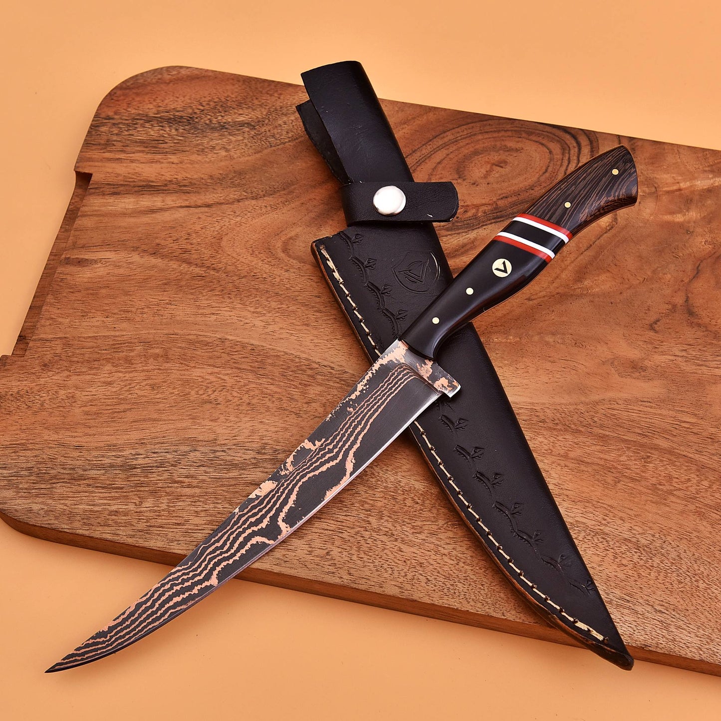 AM Inferno fillet knife displayed with its custom-fitted leather sheath