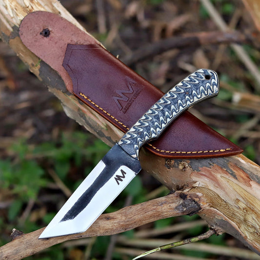 AM Shadowstrike fixed blade knife with handcrafted vertical carry leather sheath – rugged outdoor carry setup.
