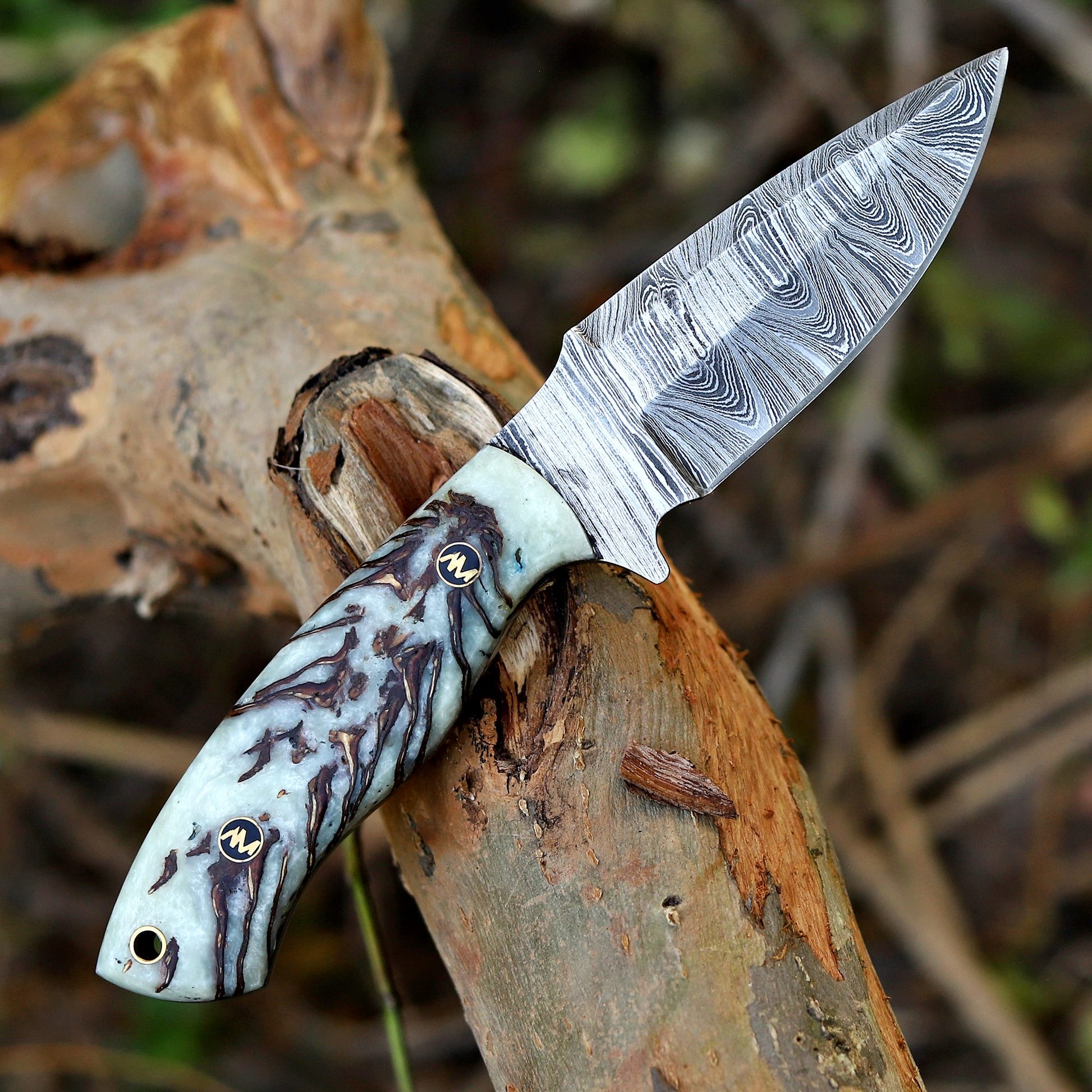 Knife with a decorative handle on a wooden surface