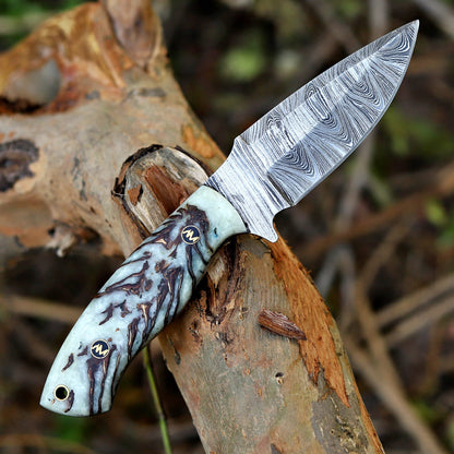 Knife with a decorative handle on a wooden surface