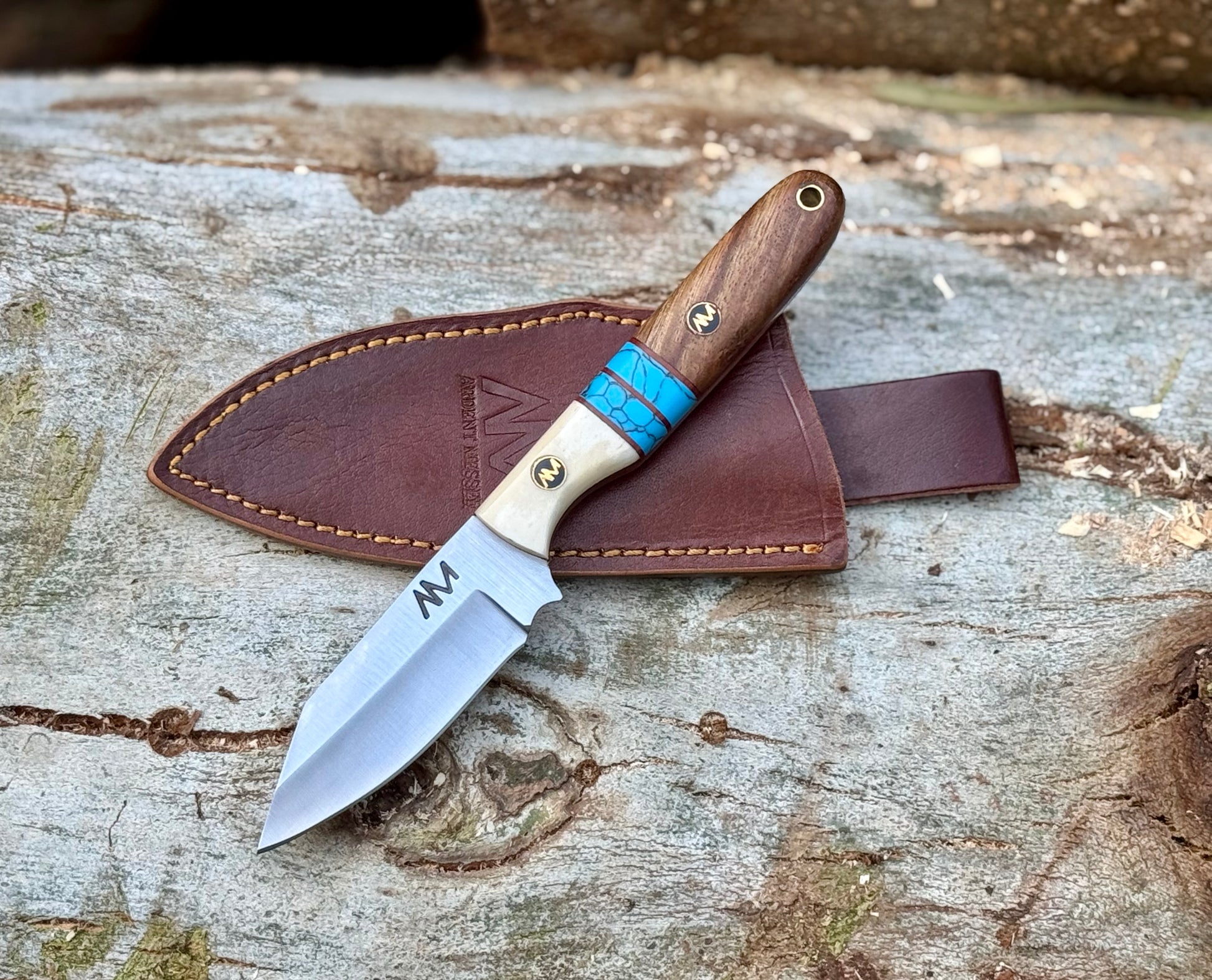 Fixed blade hunting knife with leather sheath for belt carry and ranch work