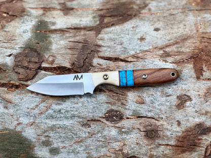 Rancher’s fixed blade knife with ergonomic exotic wood and bone handle design