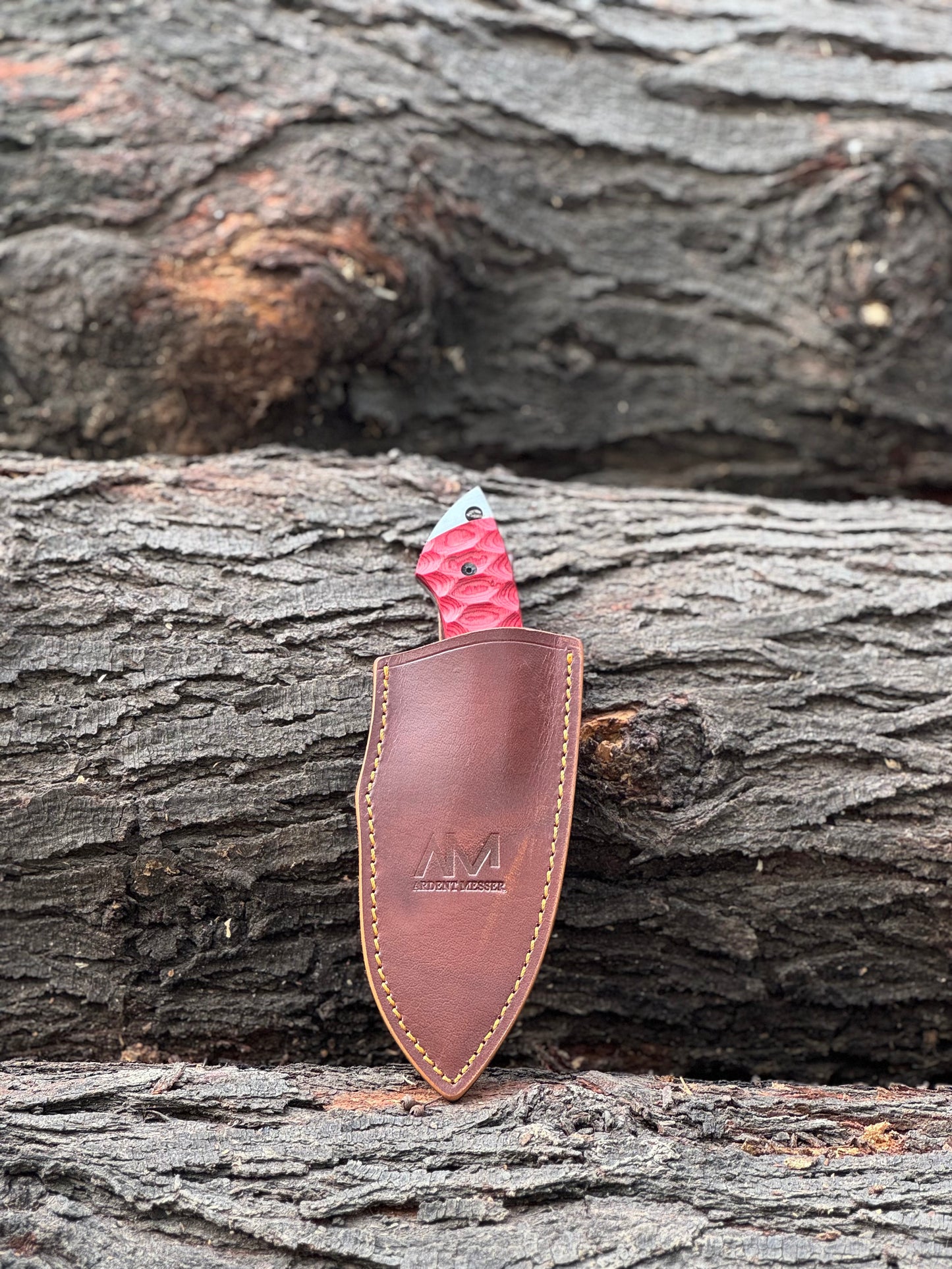 AM Reaper Fixed Blade Knife in its belt loop sheath