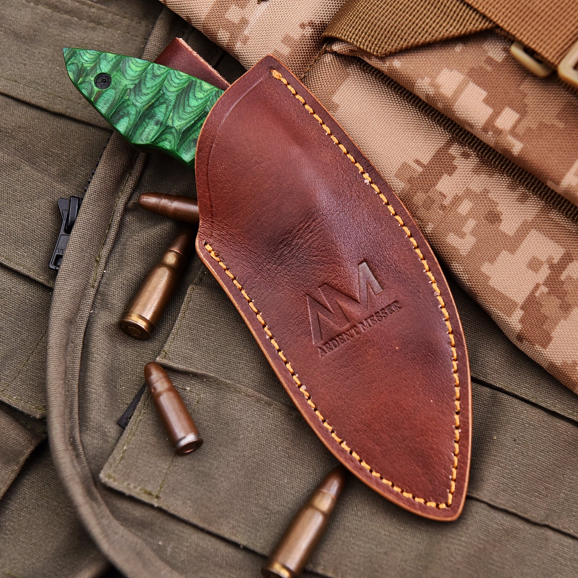 AM Viper fixed blade knife fully inserted in brown leather sheath