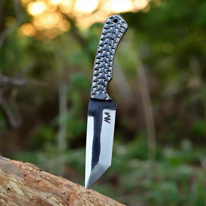 M Shadowstrike 9 inch fixed blade tanto knife photographed outdoors on rock surface – premium 12C27 steel and wood handle in natural light.