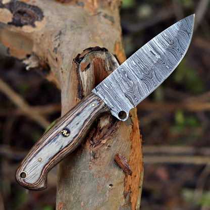 Side profile of handcrafted Damascus hunting knife with polished wood handle.